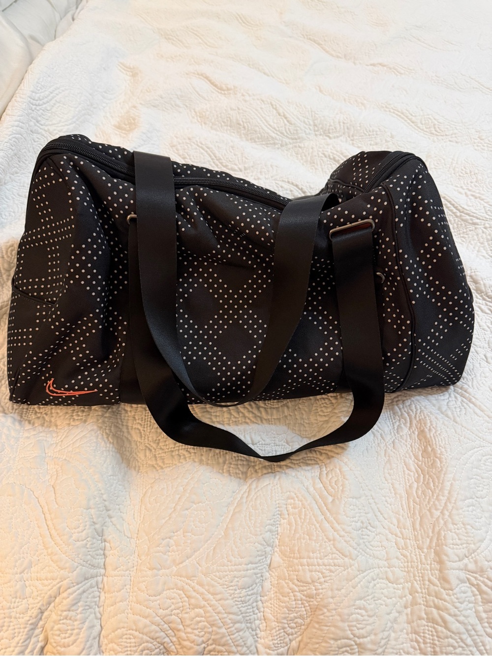 Nike Black Duffel Bag with Coral Swoosh and Dot Pattern